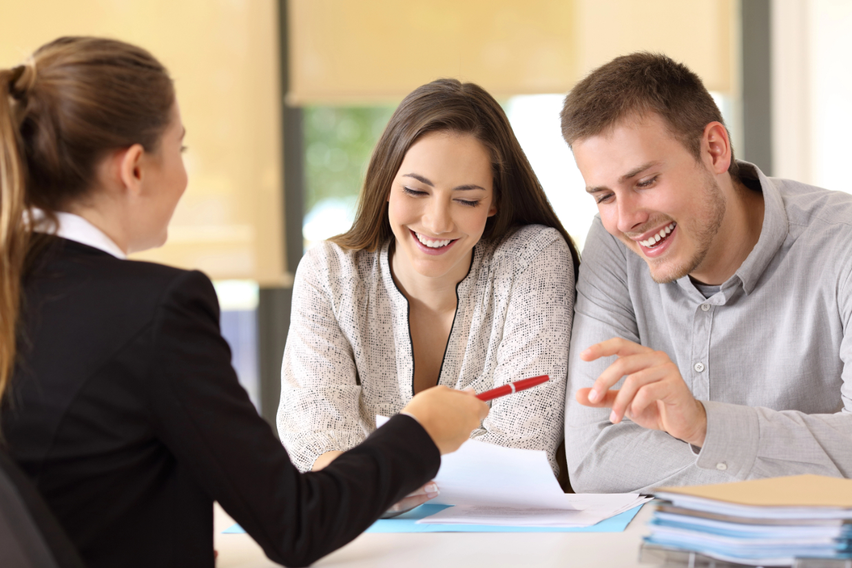 Couple Talking to an Agent